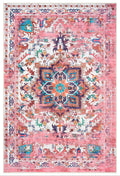A traditional Turkish pink area rug with a floral and geometric pattern.